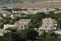 Dubai Hills Villas An expansive aerial view of a residential community surrounded by greenery in Dubai, UAE.